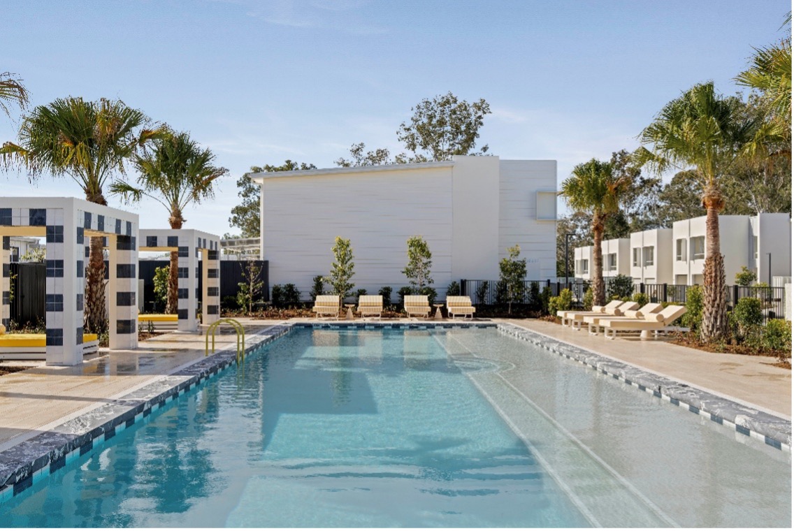 AClub - Munro AClub featuring a 20-metre swimming pool, covered cabanas, sun lounges and landscaped communal spaces designed for relaxation and connection.